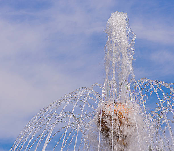 Water drops splashing from a fountain in a park