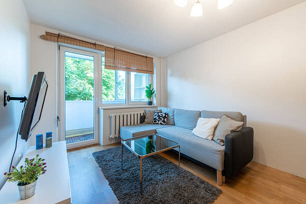 istock Modern Home Living Room Interior With Grey Sofa and Glass Coffee Table 2247184070