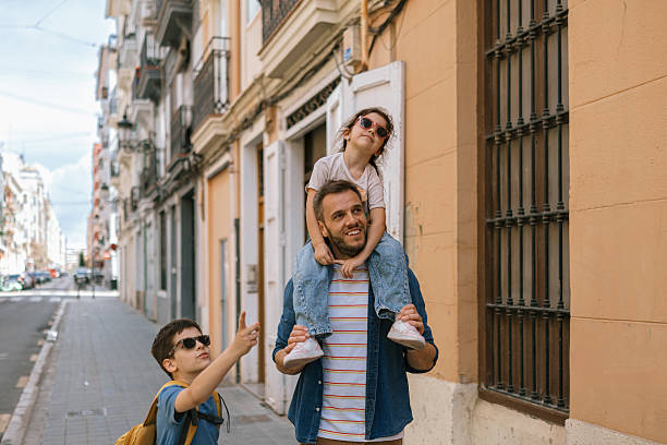 istock Dad enjoying a fun city walk with his two children 2247185025