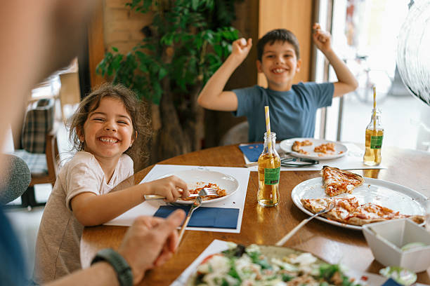 istock Happy father-kids lunch with phones, drinks, and laughter 2247186347