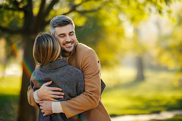 istock Happy couple embracing in park during autumn 2247186356