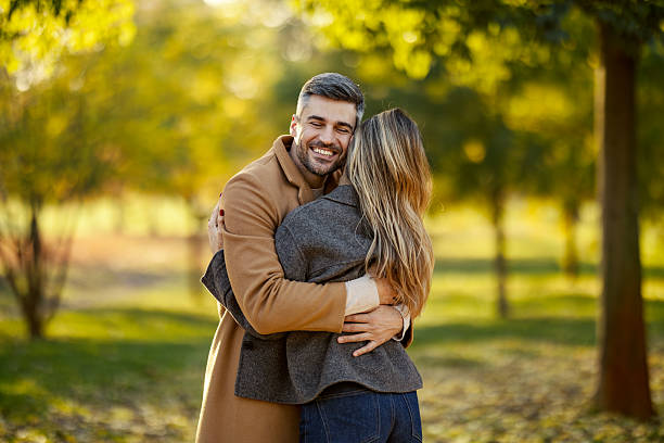 istock Happy couple embracing in autumn park 2247186363
