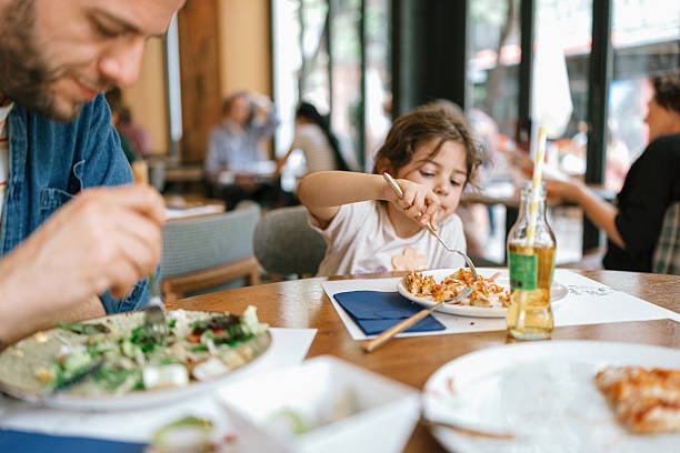 istock Kids enjoying meal at restaurant 2247186465