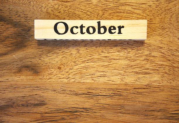Desk calendar on wood background