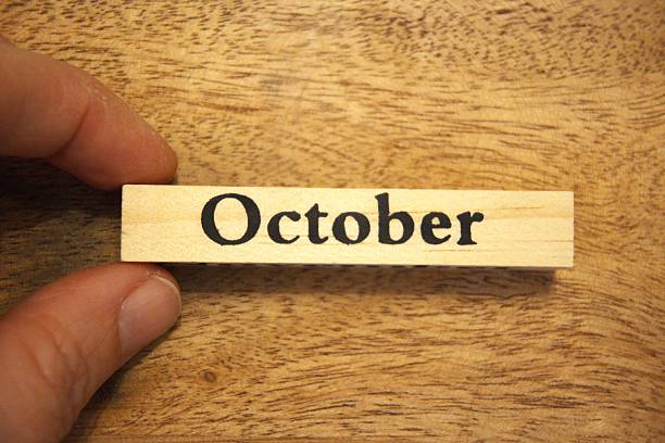 istock October text on wooden block with wooden background, Copy Space 2247188311
