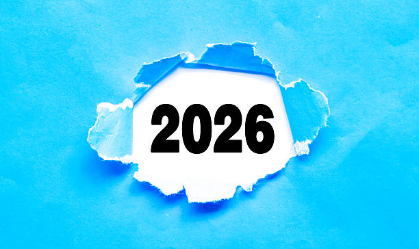 istock Torn blue paper with the 2026 placed among a white background. New year 2026 Planning Concept, reminder and New Fiscal Year preparation 2247194310