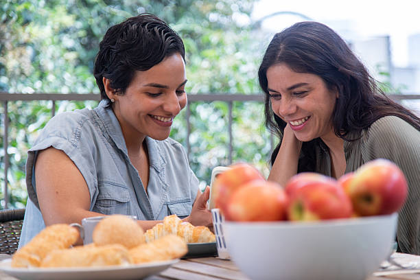 istock lesbian couple being affectionate, looking at each other 2247195517
