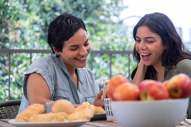 istock lesbian couple being affectionate, looking at each other 2247195522