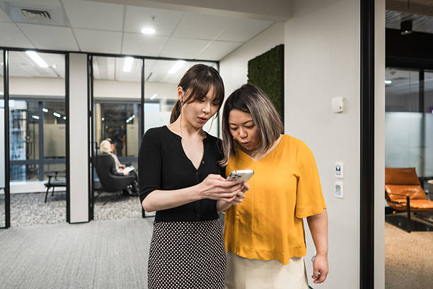 istock Worried executives reviewing phone message. 2247197678
