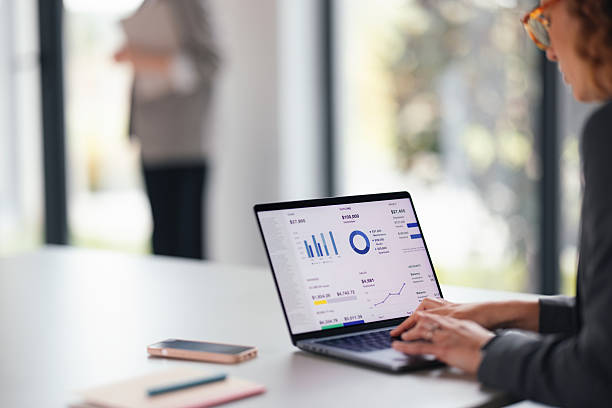 istock Businesswoman Analyzing Financial Data On Laptop In Modern Office Setting 2247197881