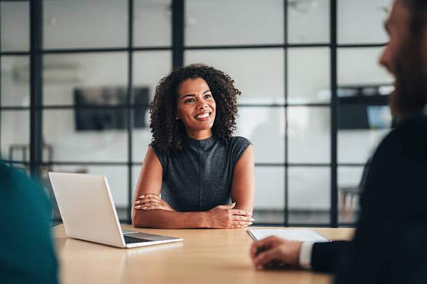 istock Insurance agents consulting clients in modern office 2247200462