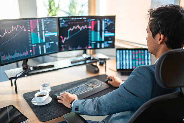 istock Male Stock Broker Analyzing Financial Data in Modern Office 2247204102