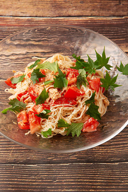 Somen noodles mixed with tomatoes and arugula
