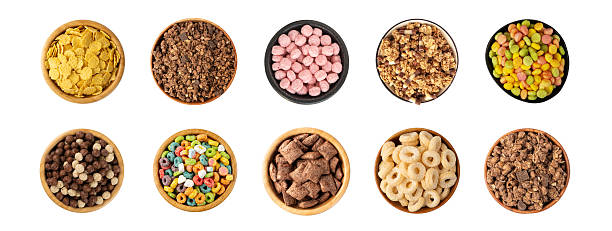 istock Assorted breakfast cereal piles isolated. Corn flakes mix, various granola food 2247208922