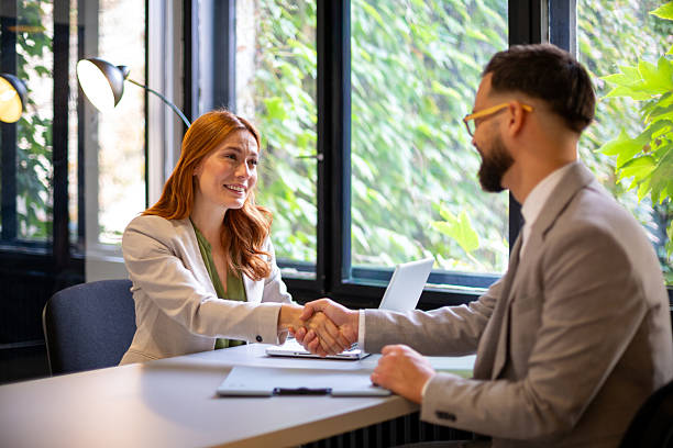 istock Business partners shaking hands during office meeting 2247210160