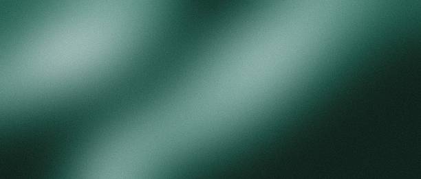 istock Emerald background with grainy gradient, soft noise, gentle blur, smooth tonal waves and calm depth, balanced negative space for captions, copy space 2247210259