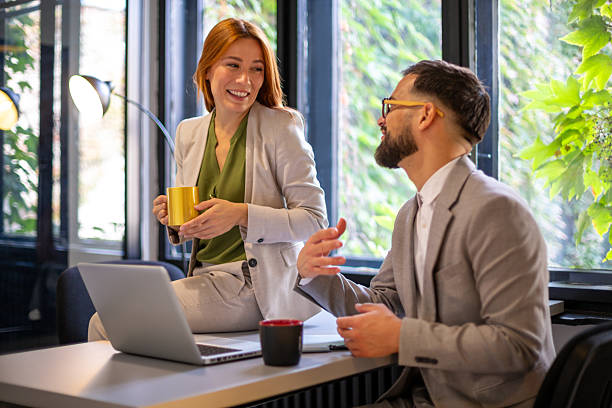 istock Business colleagues having coffee break in office 2247210295