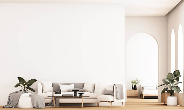istock Minimal living space with cozy sofa, light wood floor, and clean white walls emphasizing calm simplicity. 3d rendering. 2247216194