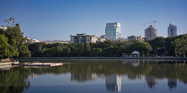 istock Urban Park Lake with Architectural Reflections 2247222591