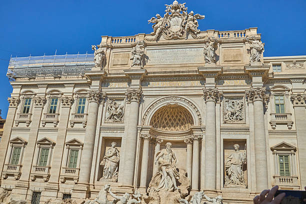istock Trevi Fountain Rome vertical view ornate sculptures and blue sky 2247224532