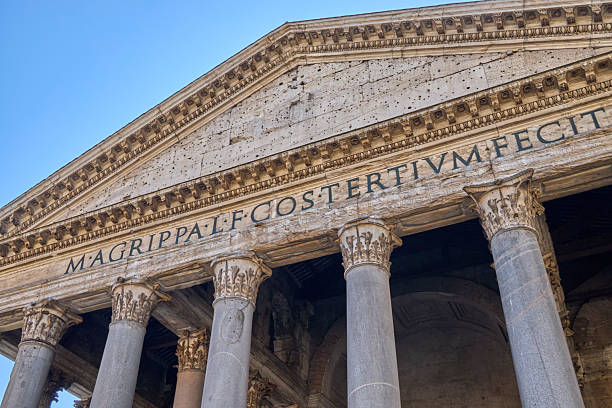 istock Ancient Roman temple columns and inscription under blue sky Pantheon Rome 2247224534