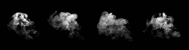 istock Realistic white smoke plumes isolated on a black background, showing four dynamic swirling shapes ideal for visual effects, motion graphics, atmospheric scenes, and creative abstract design projects. 2247225106
