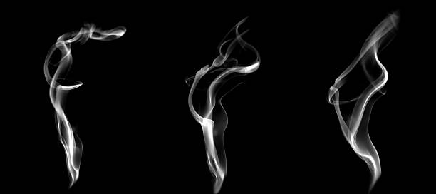 istock Abstract swirling white smoke shapes on a black background, creating a dynamic flowing texture ideal for branding, and creative visual effects that emphasize mystery, and minimalistic atmosphere. 2247225314
