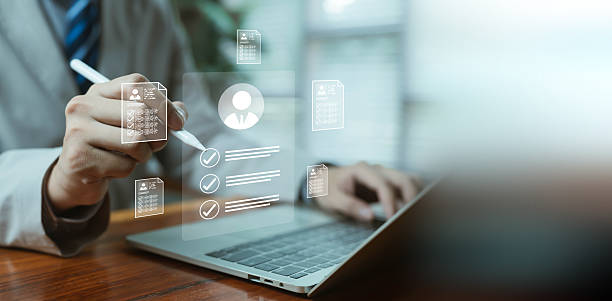 istock A professional reviewing digital candidate profiles on a laptop, symbolizing HR technology, recruitment analytics, employee evaluation, and modern hiring processes through advanced digital assessment 2247226271