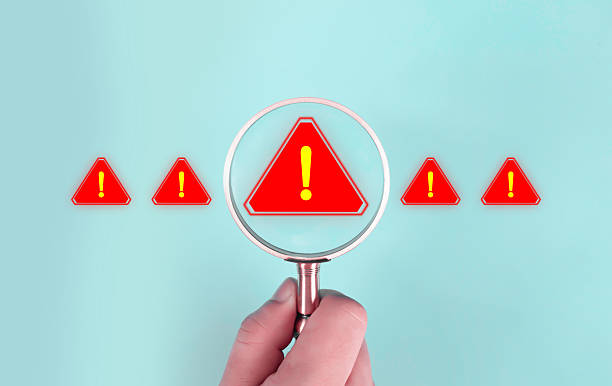 istock A magnifying glass highlighting a red warning sign with an exclamation mark, symbolizing risk detection, problem identification, monitoring, and safety warnings in a modern minimal business concept. 2247226301