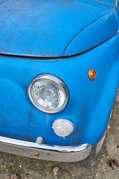 istock Close-up of vintage blue car front end with headlight 2247227525