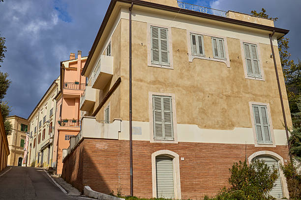 istock Sloped street with terracotta building and stone stairs 2247227698