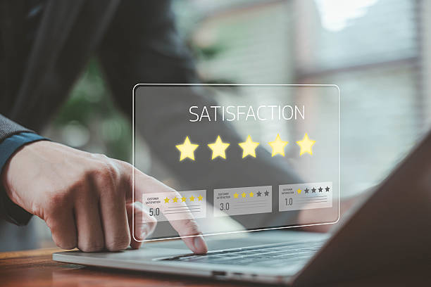 istock Business hand interacting with digital customer satisfaction ratings on a laptop, showing five-star feedback, review system, service quality measurement, user experience, and online evaluation for modern businesses. 2247231652