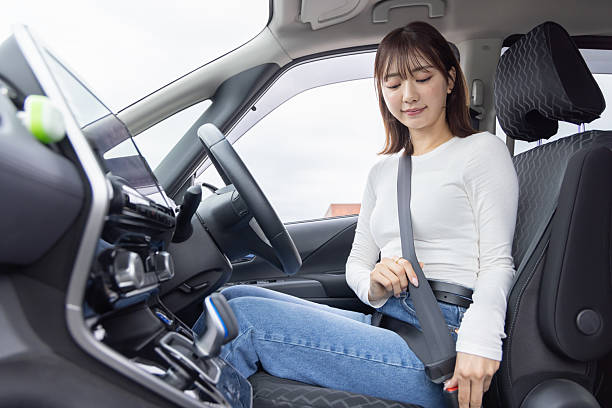istock Asian woman driving a car 2247232750
