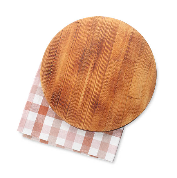 istock Wooden cutting board and napkin isolated on white, top view 2247233256