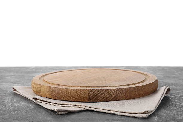 istock Wooden cutting board and napkin on grey table 2247233266