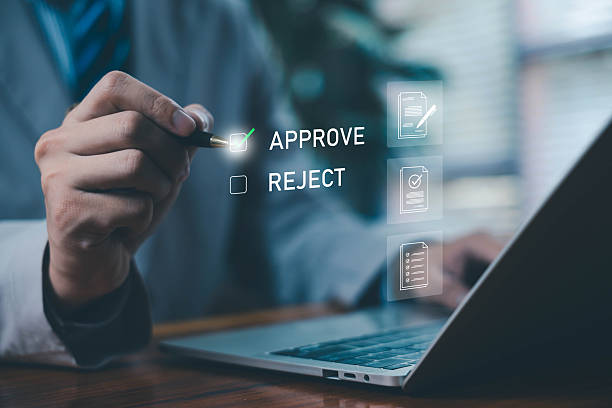 istock Business person selecting an approval option on a digital interface, symbolizing decision making, workflow authorization, document verification, online approval process, management system, and corporate digital operations. 2247233502