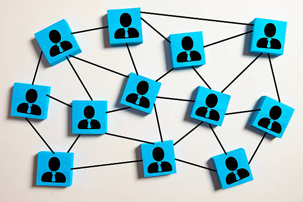 istock A network of connected blue blocks with businessman icons, symbolizing teamwork, corporate structure, and professional connections. 2247235643