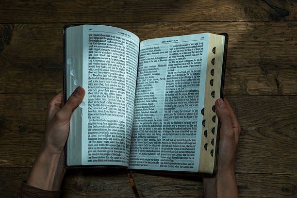 istock Woman Praying with Holy Bible 2247237039