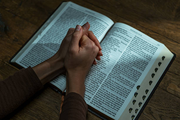Vintage Bible open to the Book of Psalms on a wood table