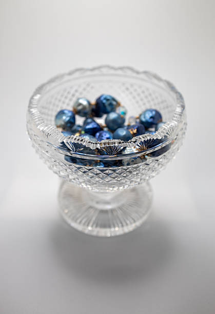 Antique  footed crystal bowl with blue jewelry beads