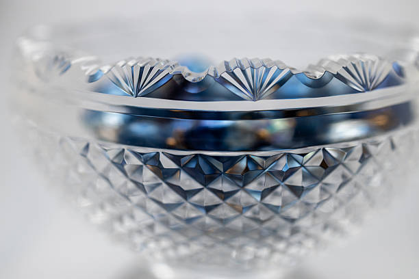 istock Antique  footed crystal bowl with blue jewelry beads 2247237076