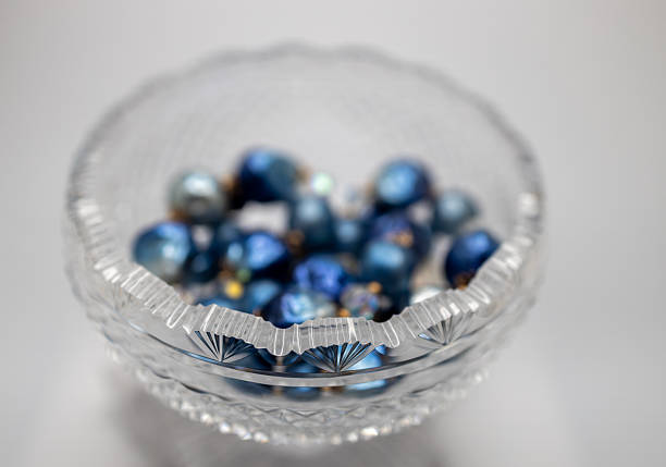 Antique  footed crystal bowl with blue jewelry beads