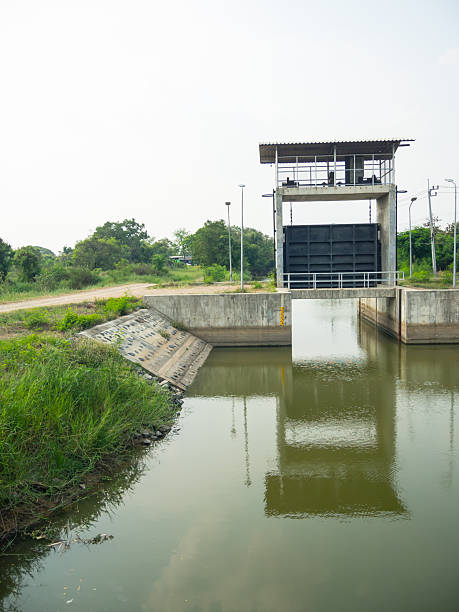 istock Metal gate Water Barrier at a dam 2247240463