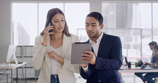 istock Phone call, teamwork and business people with tablet, discussion and planning with assistance. Employees, help and woman with cellphone, man and tech with email, deadline and connection with app 2247240875