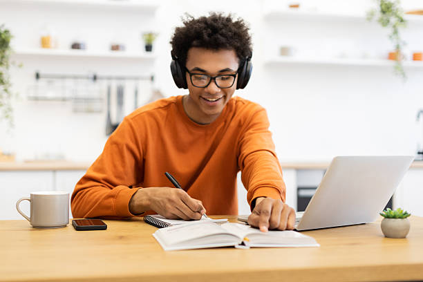 istock Student Studying with Laptop and Headphones 2247241697