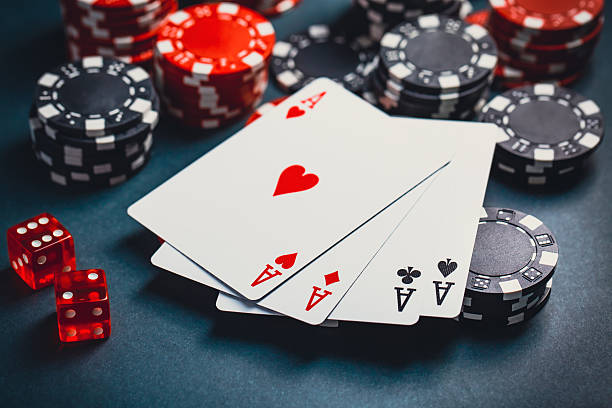 istock Stack of chips and cards on a table - poker game concept 2247241729