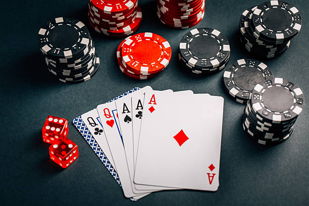 istock Stack of chips and cards on a table - poker game concept 2247241730