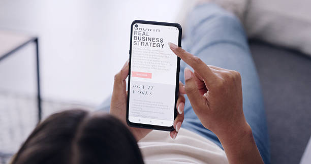 istock Phone screen, reading and woman relax on couch, online article or blog tips for startup entrepreneur. Business owner, digital info or person with mobile for research, recommendation and above in home 2247241804