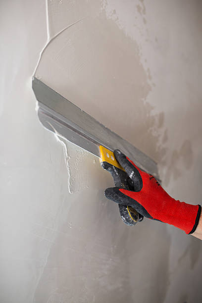 istock A masters hand in a red glove with a spatula 2247242426