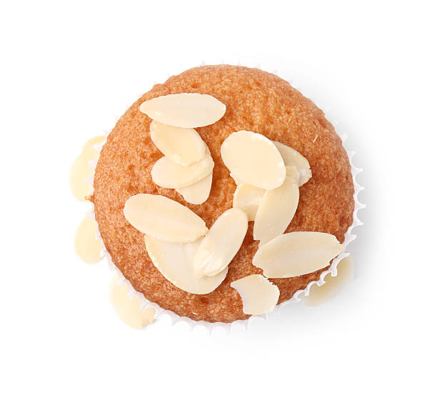 istock Muffin with fresh almond flakes isolated on white, top view 2247242500